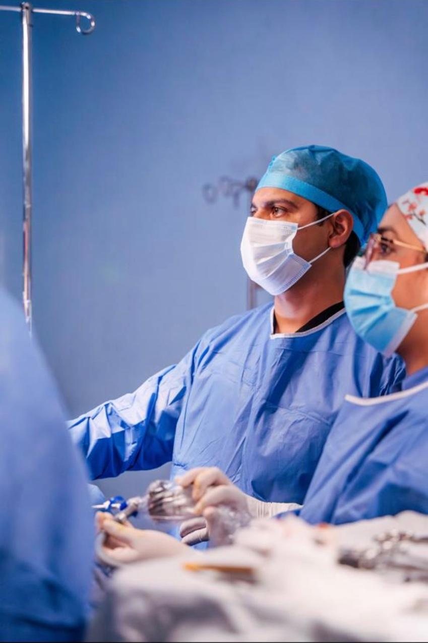 Dr. Agustín Cervantes operating in the OR